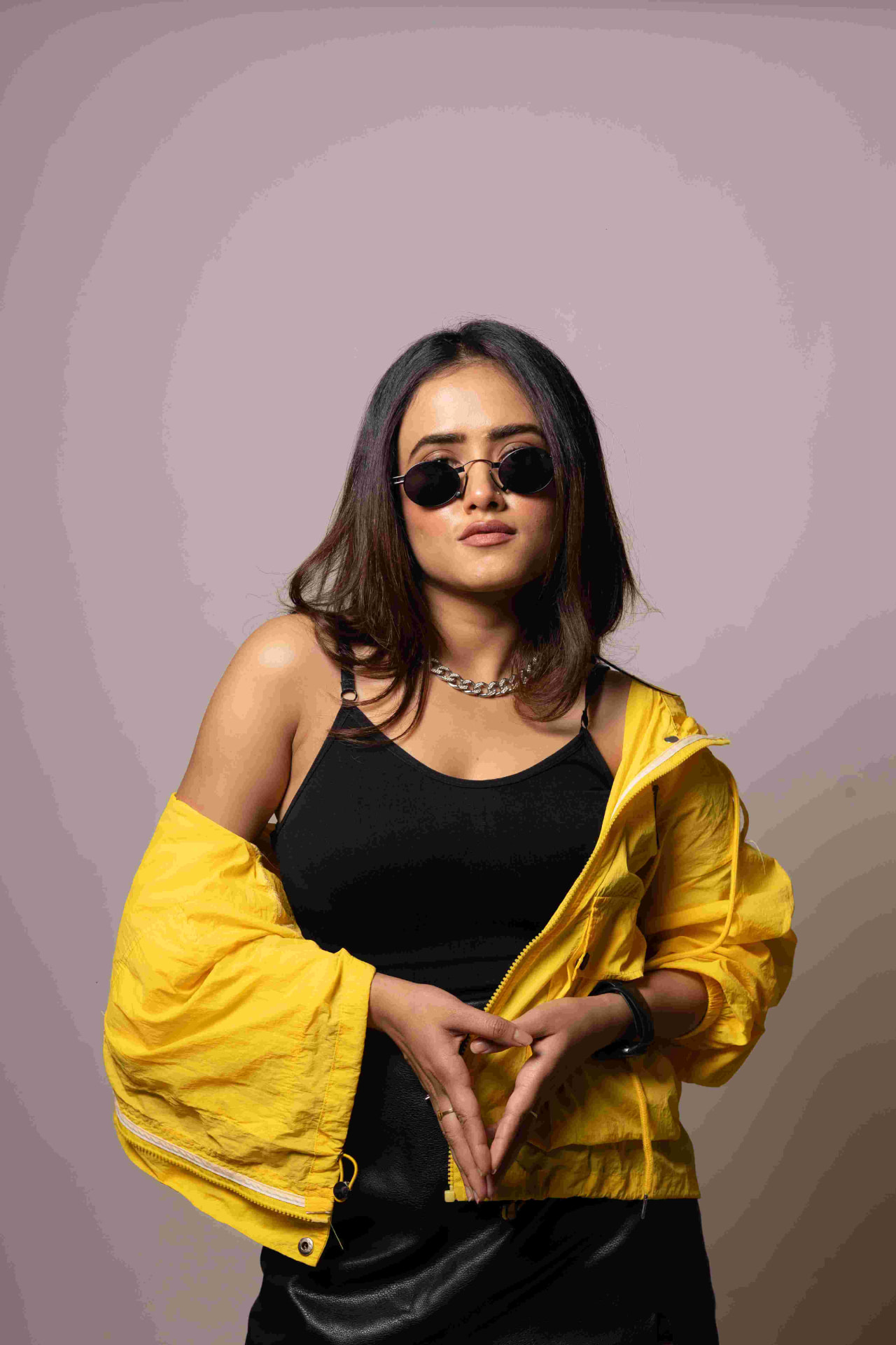 DJ Koyel, Kolkata-based DJ, in a yellow jacket studio portrait